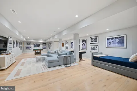 a room with pool table and window