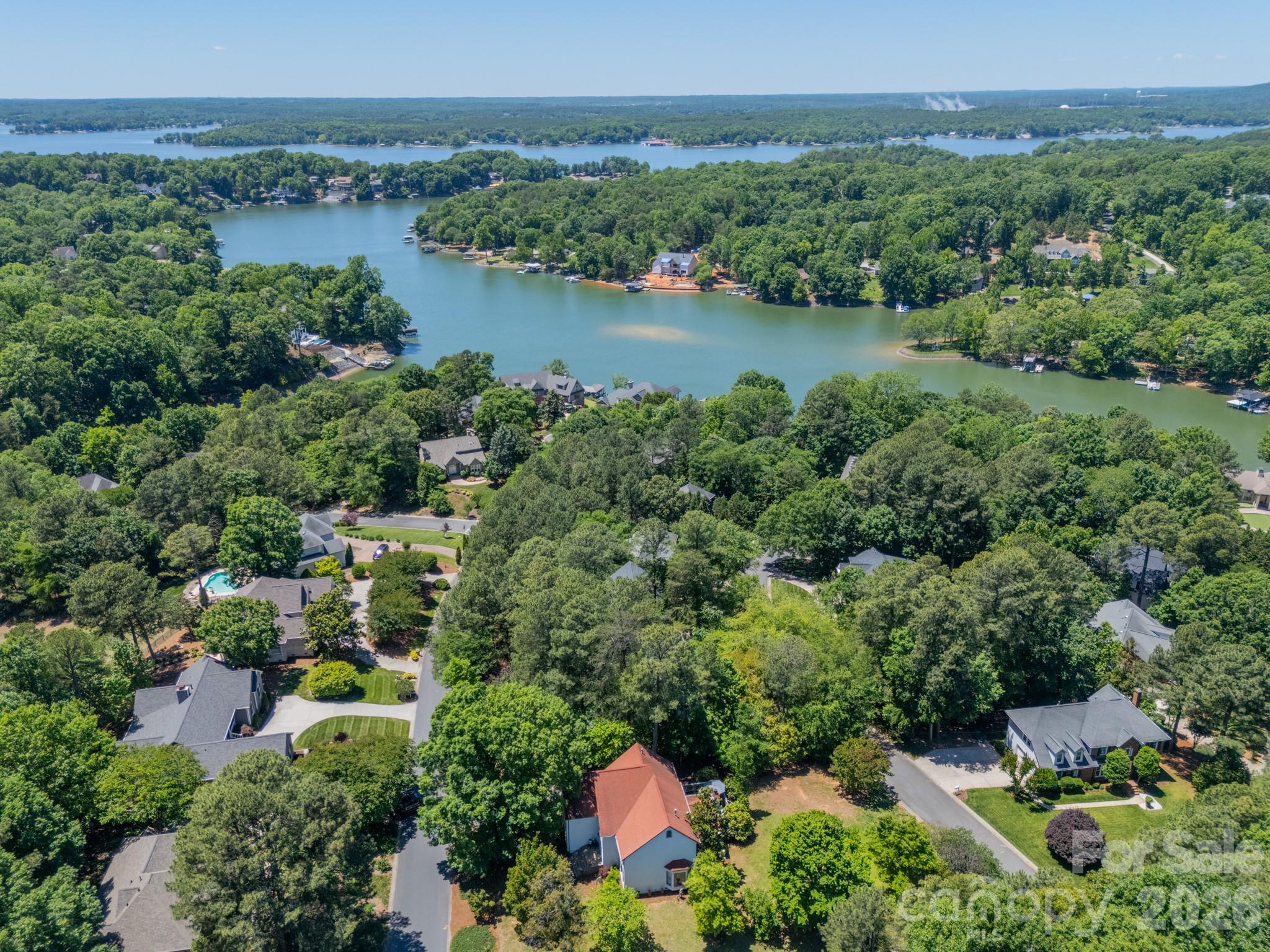 11043 Seven Coves Drive Tega Cay, SC 29708 - Photo 42 of 45 an aerial view of a house with a yard and lake view