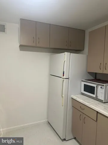 a utility room with sink dryer and washer