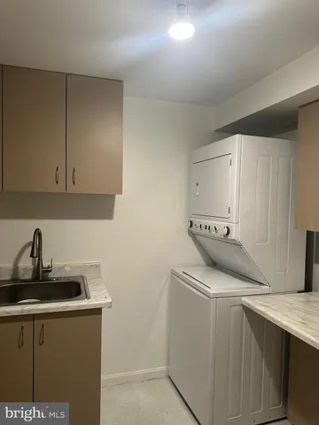 a kitchen with a sink cabinets and appliances