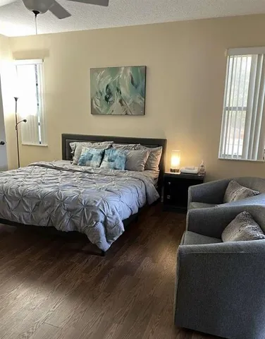 a spacious bedroom with a bed and a fireplace