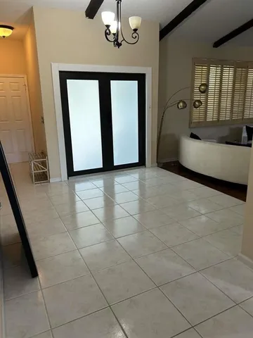 a view of a room with furniture and window