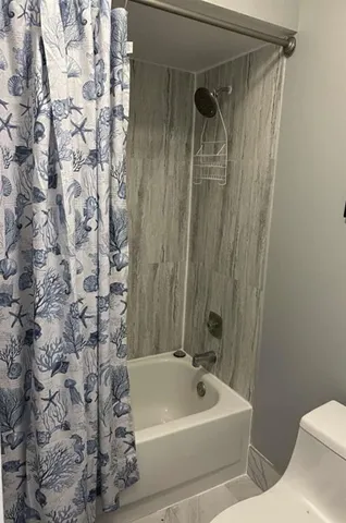a bathroom with a sink and shower