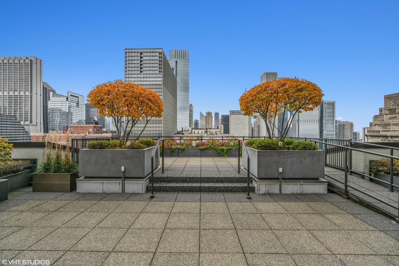 310 South Michigan Avenue, Unit 1010 Chicago, IL 60604 - Photo 14 of 15 a view of a terrace with couches and potted plants