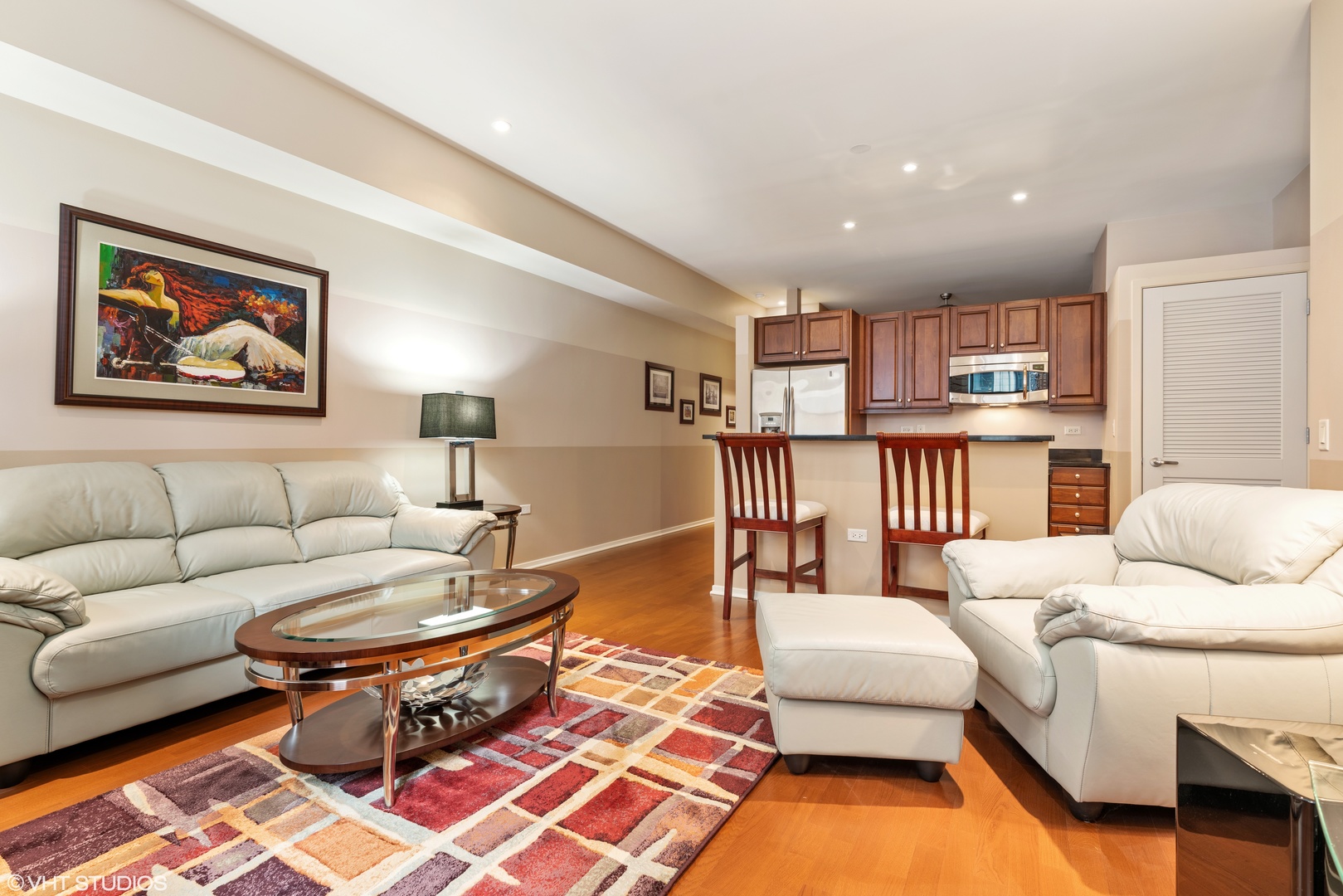 310 South Michigan Avenue, Unit 1010 Chicago, IL 60604 - Photo 5 of 15 a living room with furniture and a wooden floor