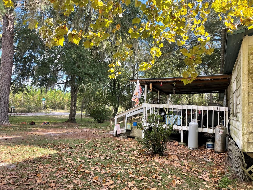 15206 Howard Road Bryceville, FL 32009 - Photo 2 of 13 a front view of a house with a yard