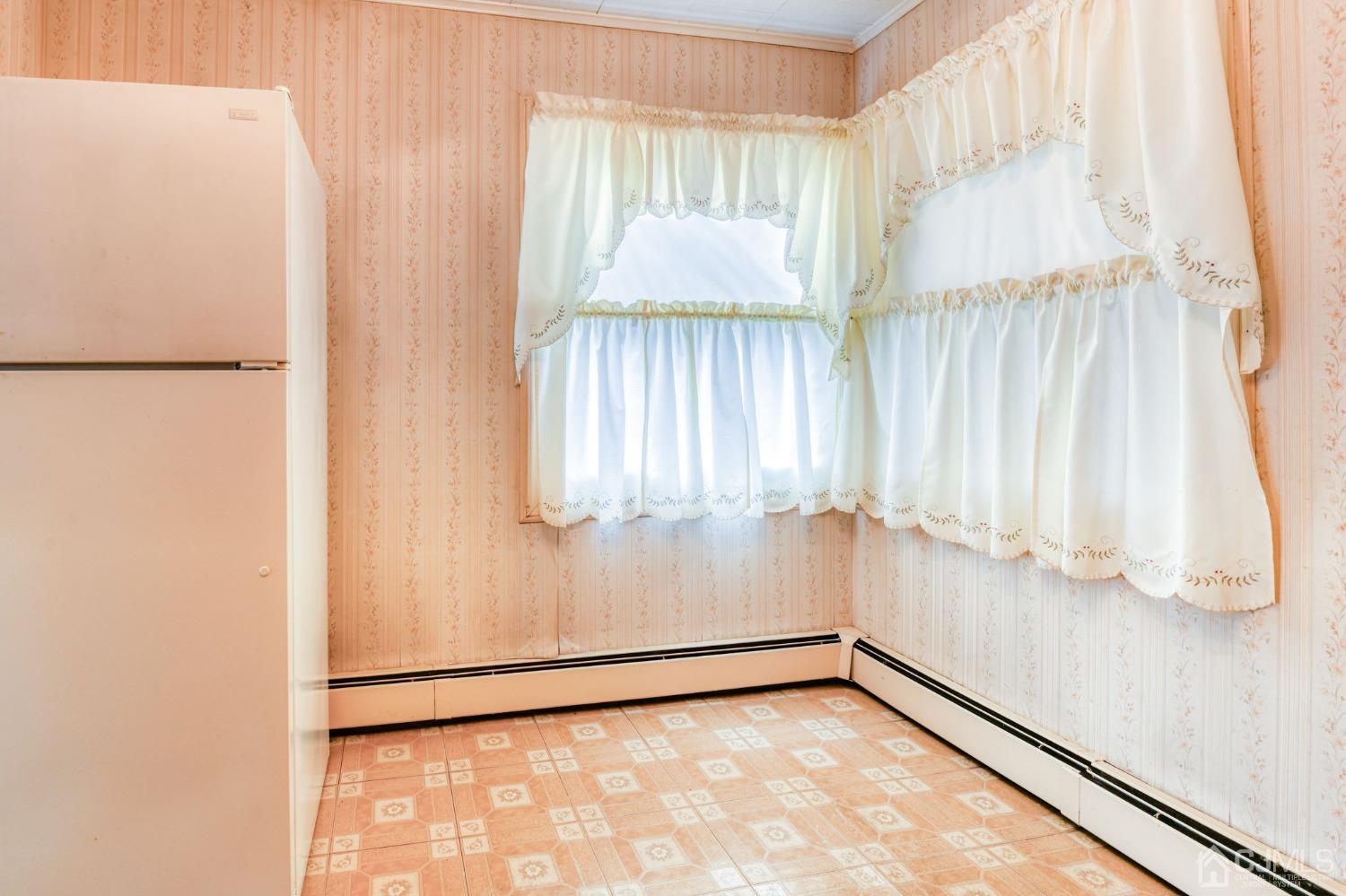 22 Parkerson Road Edison, NJ 08817 - Photo 11 of 29 a view of an empty room with a window