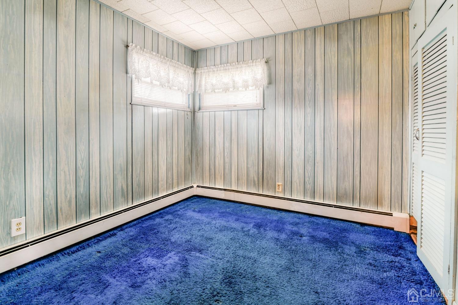 22 Parkerson Road Edison, NJ 08817 - Photo 16 of 29 a view of an empty room with wooden floor and a window