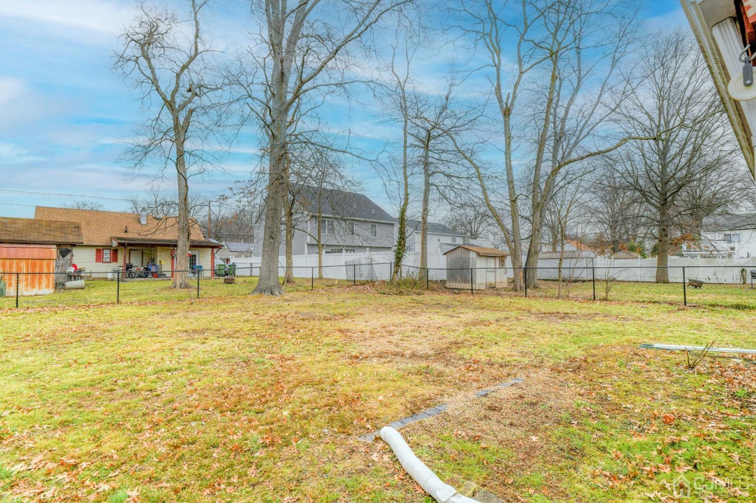 22 Parkerson Road Edison, NJ 08817 - Photo 22 of 29 a view of swimming pool with lawn chairs and large trees