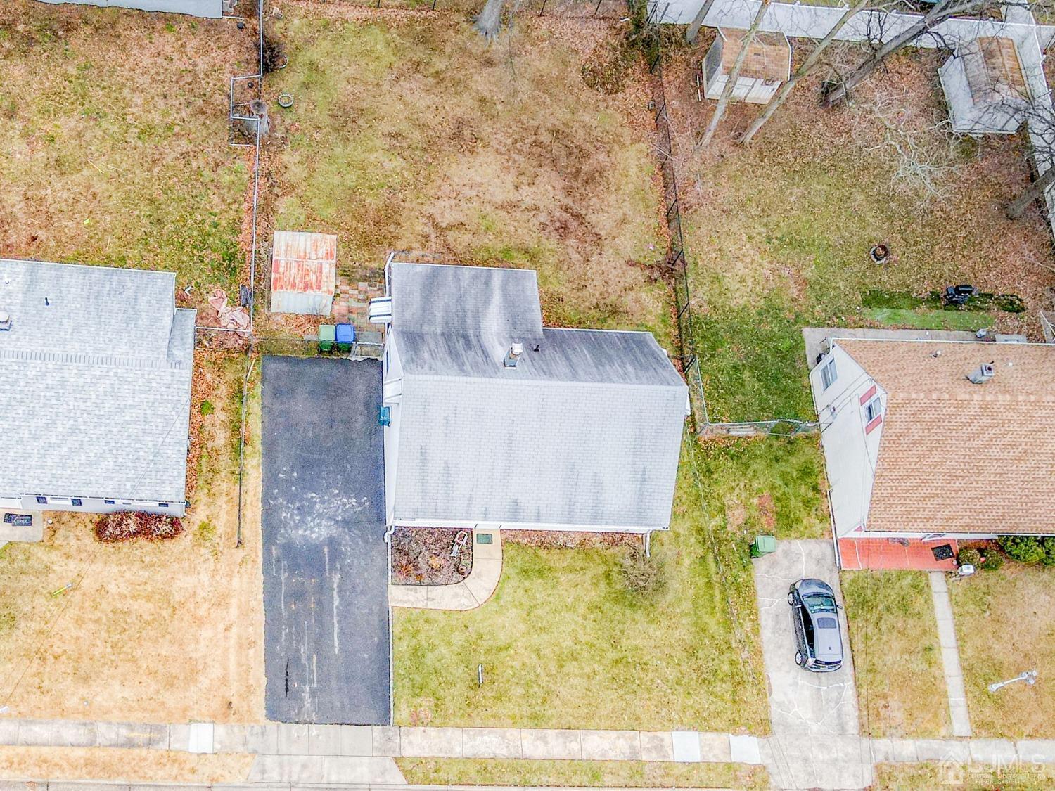 22 Parkerson Road Edison, NJ 08817 - Photo 27 of 29 front view of a brick house with a yard