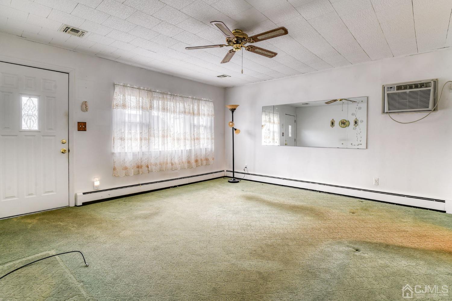 22 Parkerson Road Edison, NJ 08817 - Photo 4 of 29 a view of an empty room with a window