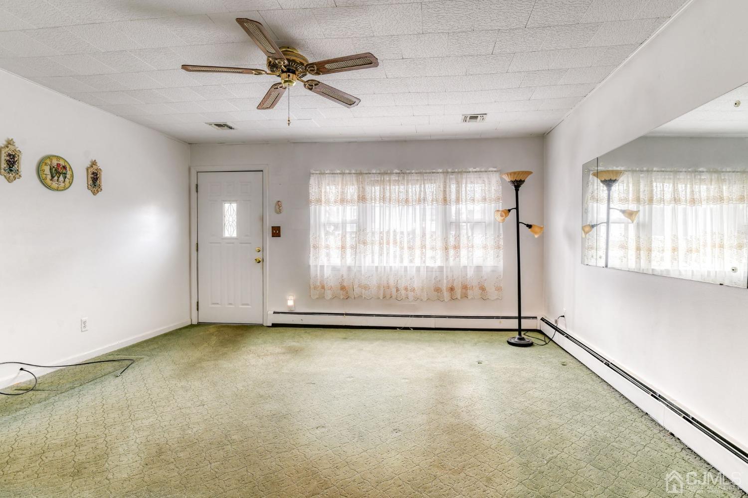 22 Parkerson Road Edison, NJ 08817 - Photo 5 of 29 a view of an empty room with a window