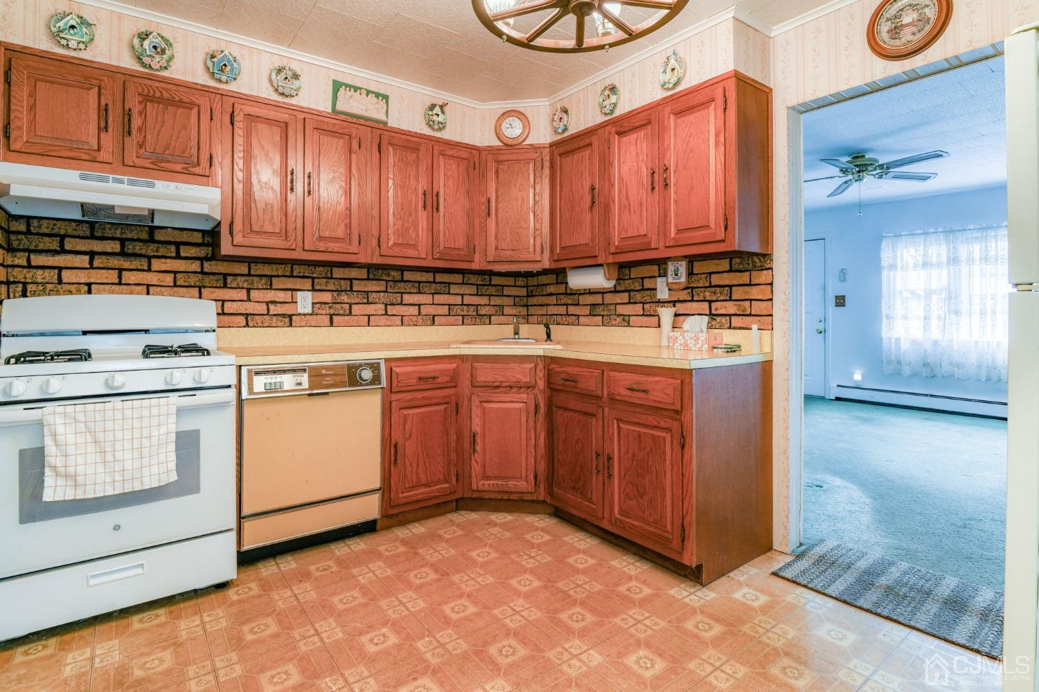 22 Parkerson Road Edison, NJ 08817 - Photo 7 of 29 a kitchen with a stove top oven sink and cabinets