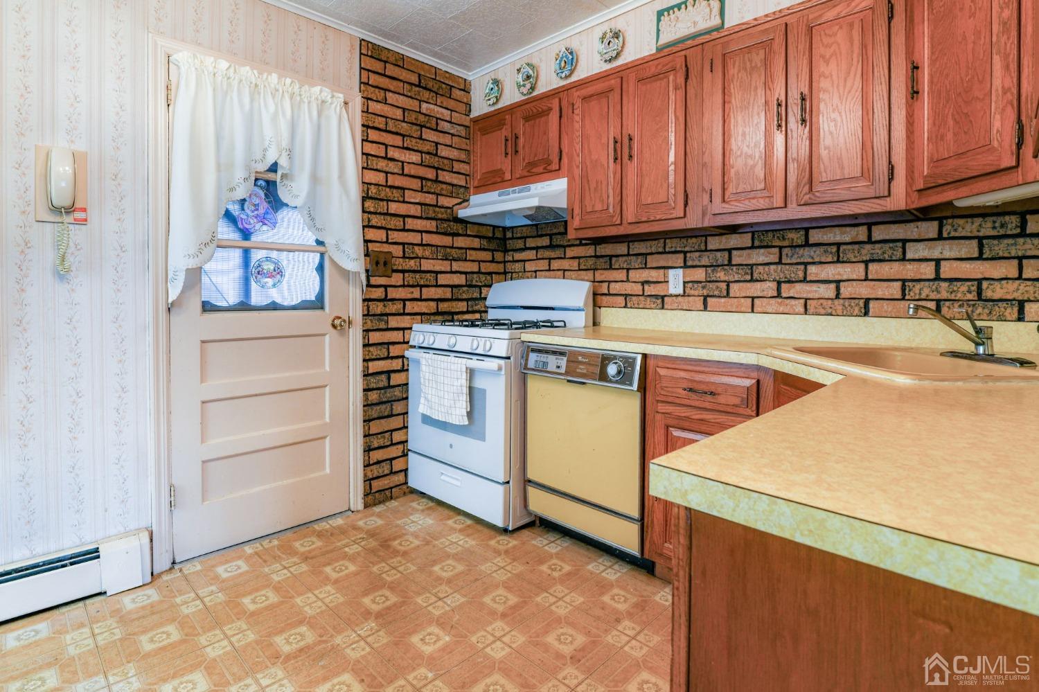 22 Parkerson Road Edison, NJ 08817 - Photo 8 of 29 a kitchen with a stove and a cabinets