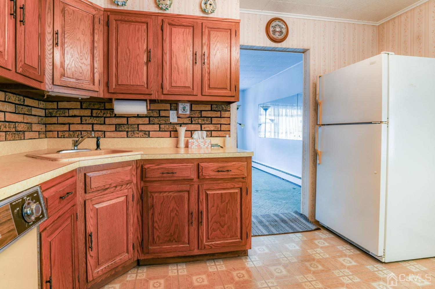 22 Parkerson Road Edison, NJ 08817 - Photo 9 of 29 a kitchen with stainless steel appliances granite countertop a refrigerator and a sink