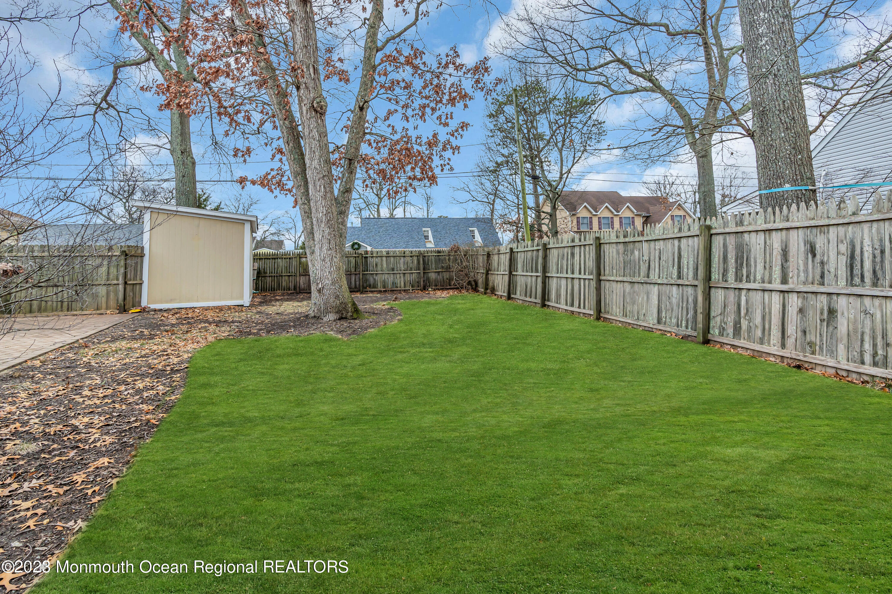 1007 Beaver Dam Road Point Pleasant, NJ 08742 - Photo 42 of 45 a backyard of a house with lots of green space