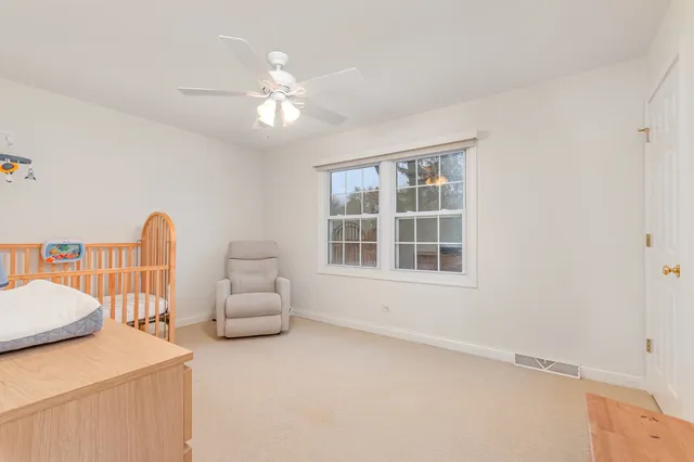 a bedroom with furniture and window
