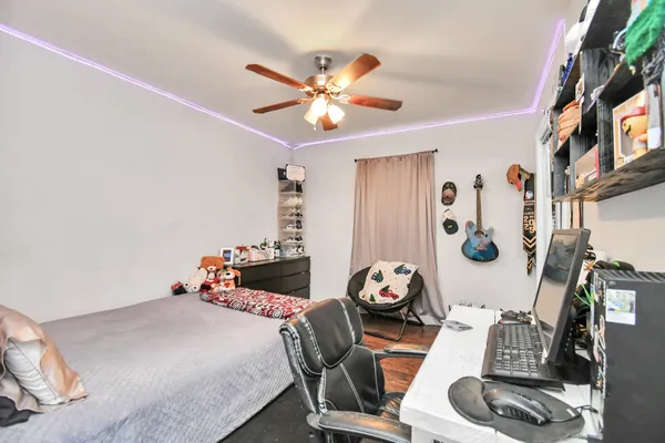 a bedroom with furniture and a chandelier