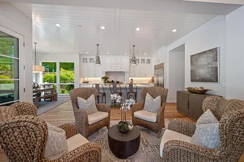 a view of living room with furniture and floor to ceiling windows