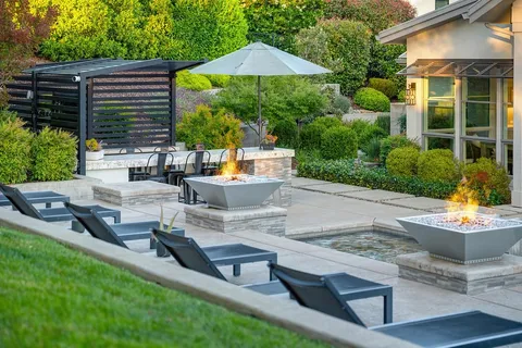 a view of backyard with swimming pool and outdoor seating