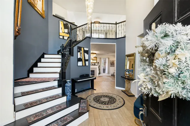 a view of a livingroom with furniture and staircase