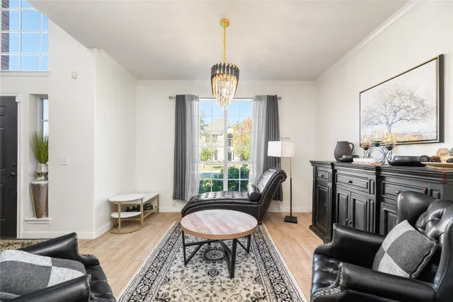 a view of a livingroom with furniture and a window