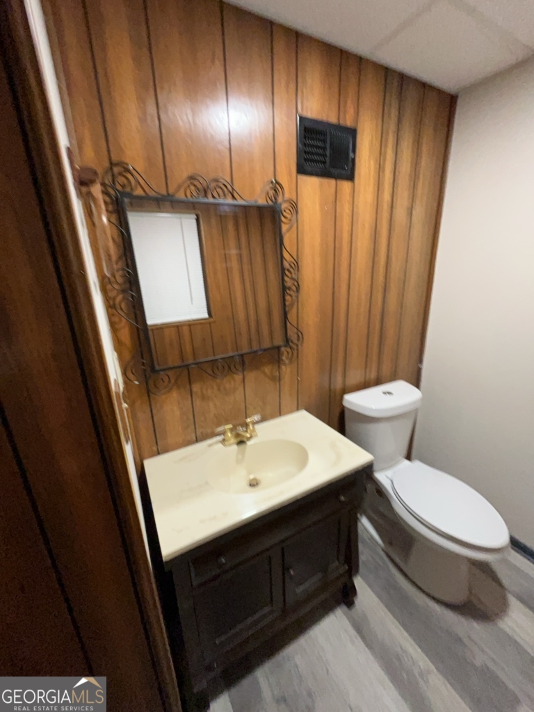 1265 Herrington Road Lawrenceville, GA 30044 - Photo 43 of 52 a bathroom with a sink a toilet a mirror and shower