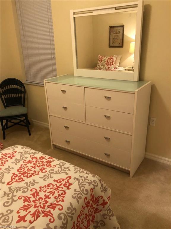 1911 Morning Sun Lane Naples, FL 34119 - Photo 15 of 17 a bathroom with a sink and a mirror