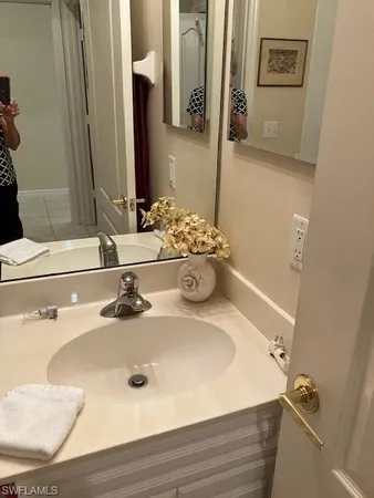 a bathroom with a sink and a mirror