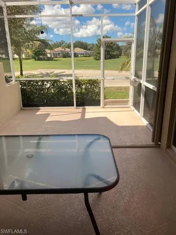 a view of a floor to ceiling window and an outdoor view