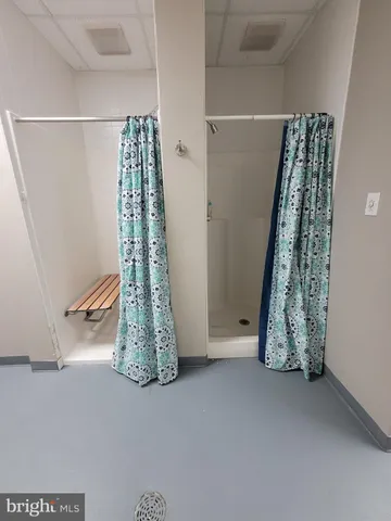 a view of a house with swimming pool and sitting area