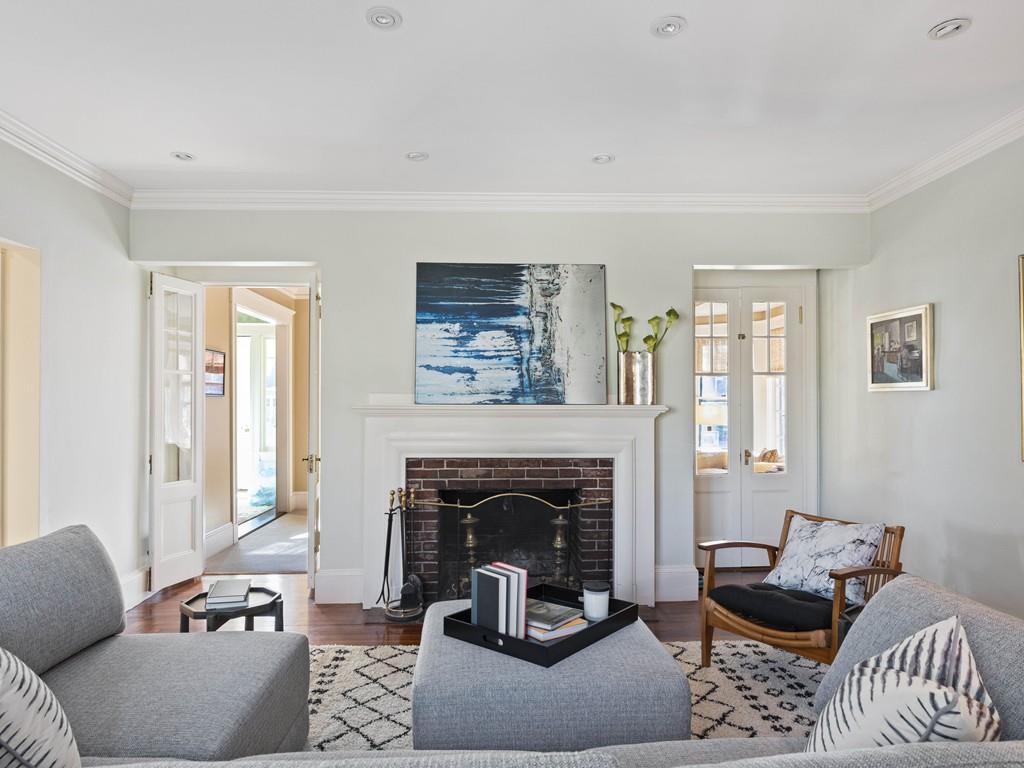 22 Cushing Road Wellesley, MA 02481 - Photo 20 of 28 a living room with furniture and a fireplace