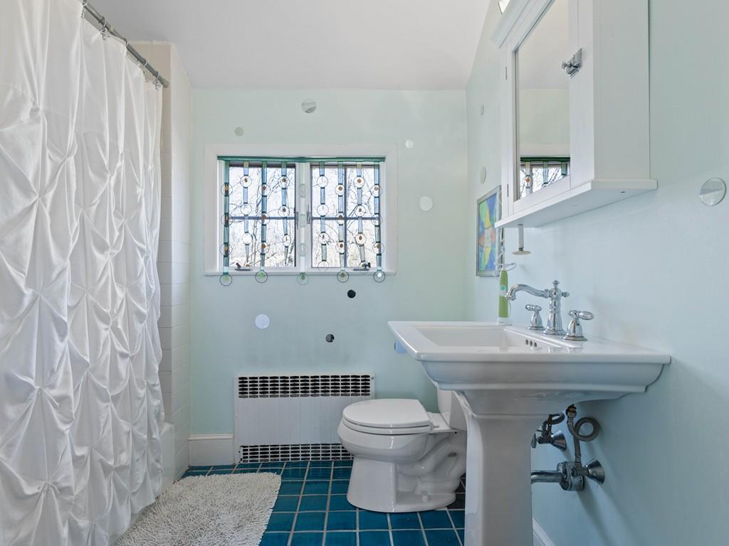 22 Cushing Road Wellesley, MA 02481 - Photo 23 of 28 a bathroom with a sink toilet and a mirror