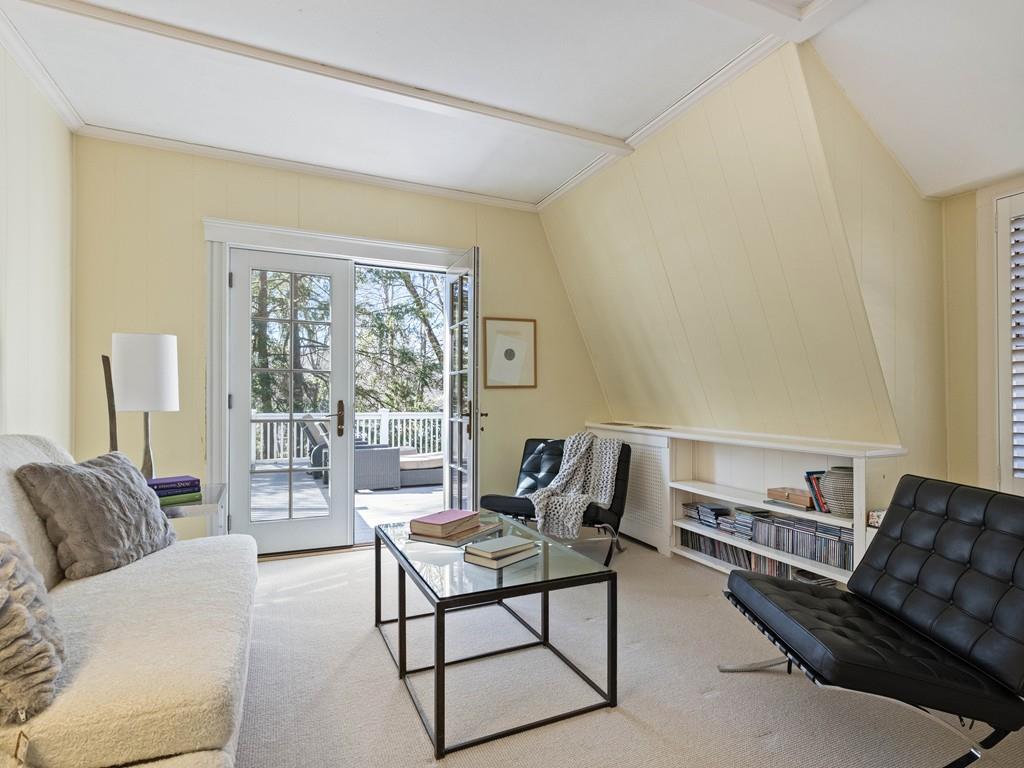22 Cushing Road Wellesley, MA 02481 - Photo 24 of 28 a living room with furniture and a window