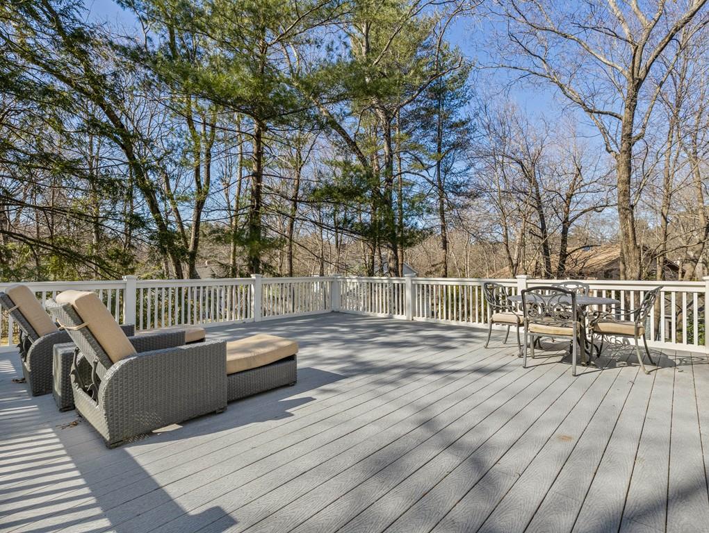22 Cushing Road Wellesley, MA 02481 - Photo 25 of 28 a view of a deck with couches and wooden floor