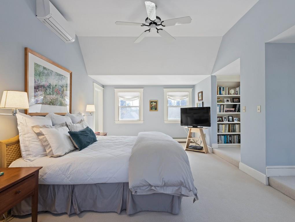 22 Cushing Road Wellesley, MA 02481 - Photo 27 of 28 a bedroom with a bed window and a chair
