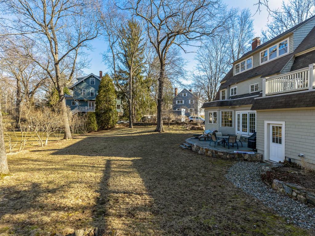 22 Cushing Road Wellesley, MA 02481 - Photo 4 of 28 a view of a house with backyard and trees