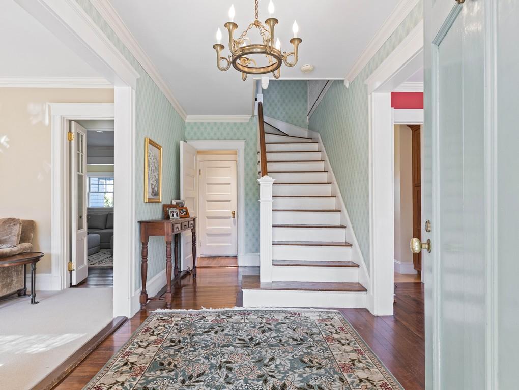 22 Cushing Road Wellesley, MA 02481 - Photo 10 of 28 a view of a hallway with furniture and a rug