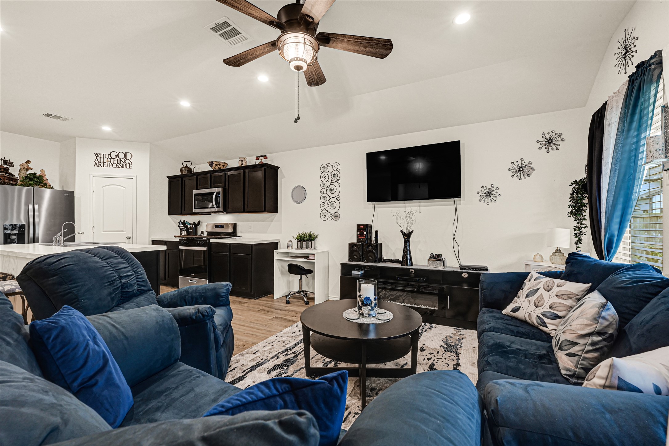 14968 Bergamot Colony Street Splendora, TX 77372 - Photo 11 of 25 a living room with furniture and a flat screen tv