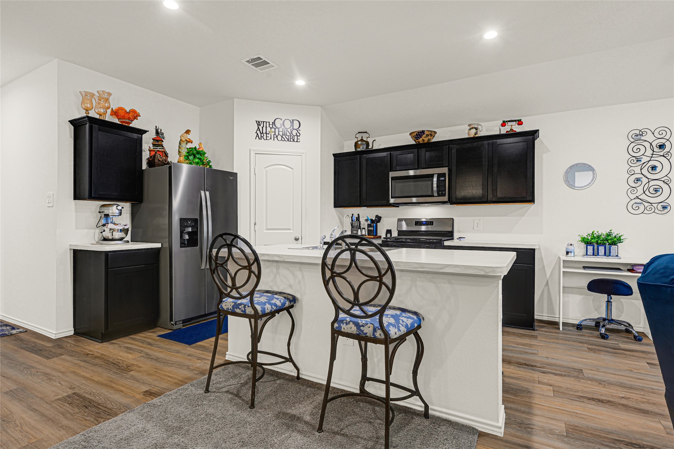 14968 Bergamot Colony Street Splendora, TX 77372 - Photo 13 of 25 a view of a workspace with furniture and wooden floor
