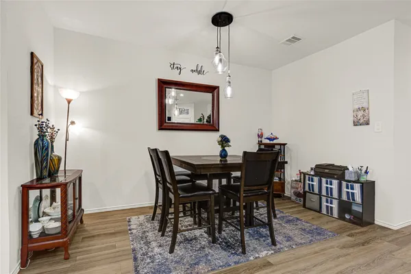 a view of a dining room with furniture