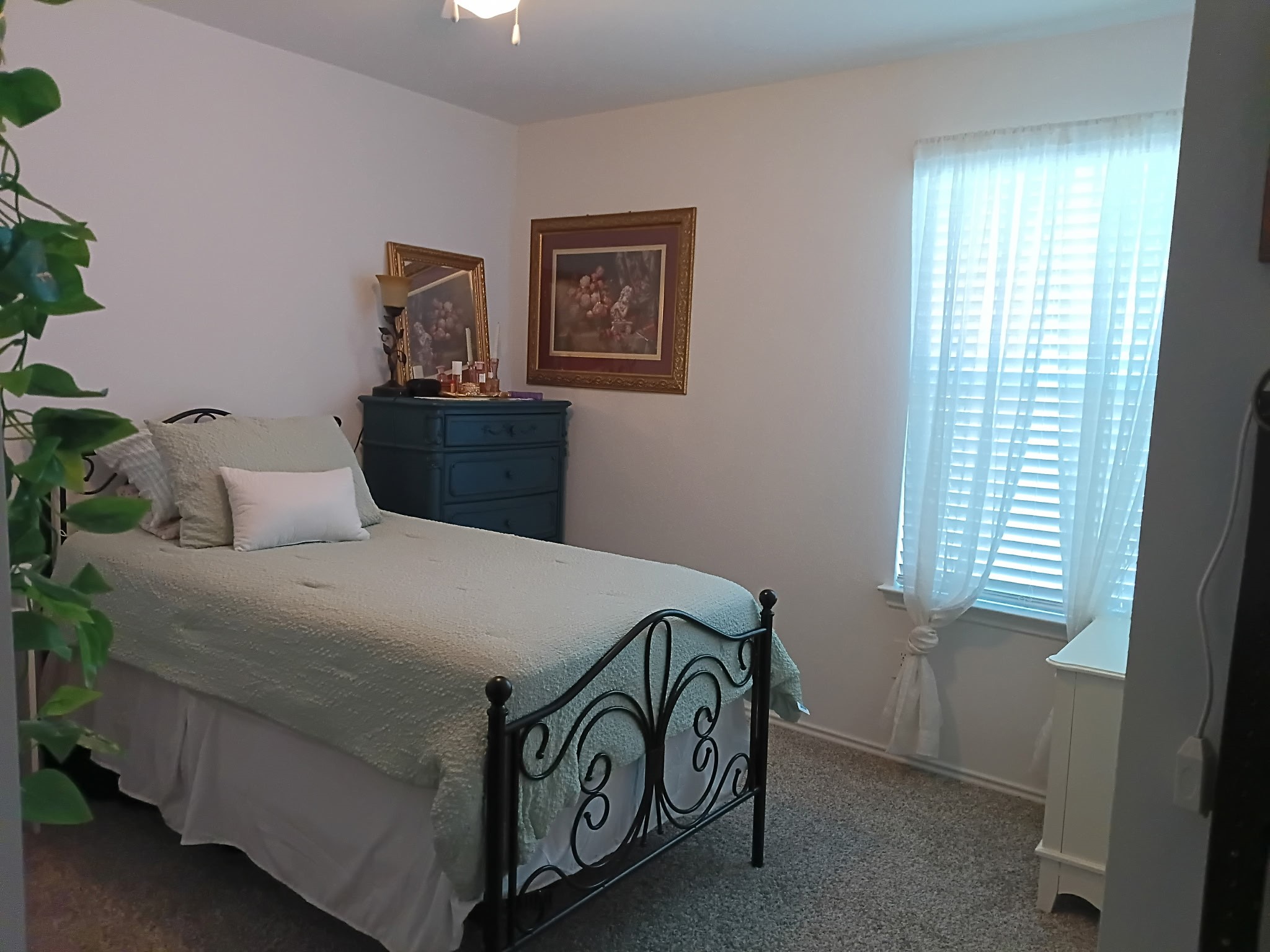 14968 Bergamot Colony Street Splendora, TX 77372 - Photo 21 of 25 a bedroom with a bed and a window
