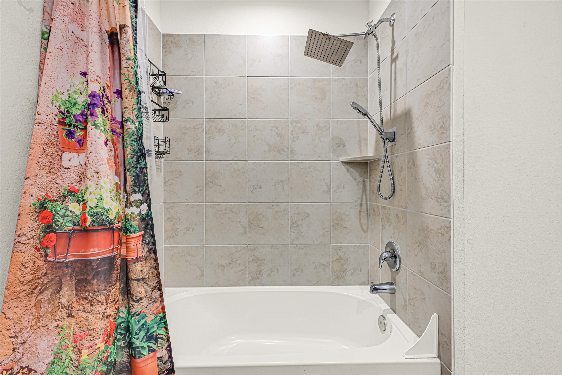 14968 Bergamot Colony Street Splendora, TX 77372 - Photo 23 of 25 a bathroom with a bathtub and a shower