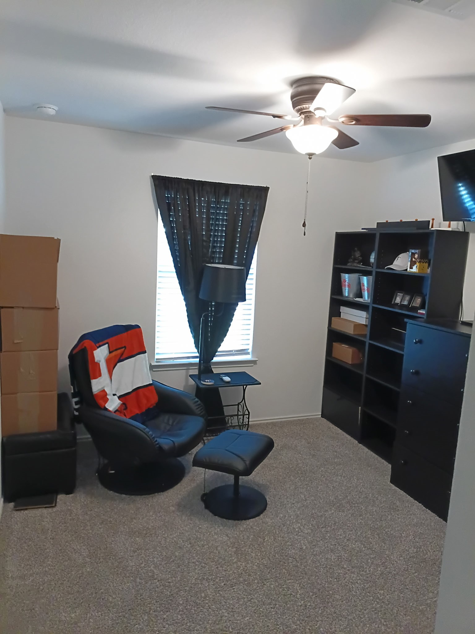 14968 Bergamot Colony Street Splendora, TX 77372 - Photo 25 of 25 a living room with furniture a chandelier and a window