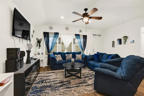 a living room with furniture fireplace and a flat screen tv