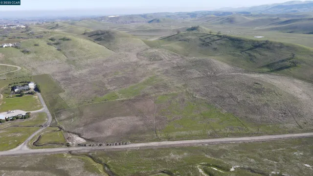 a view of a town with mountains in the background