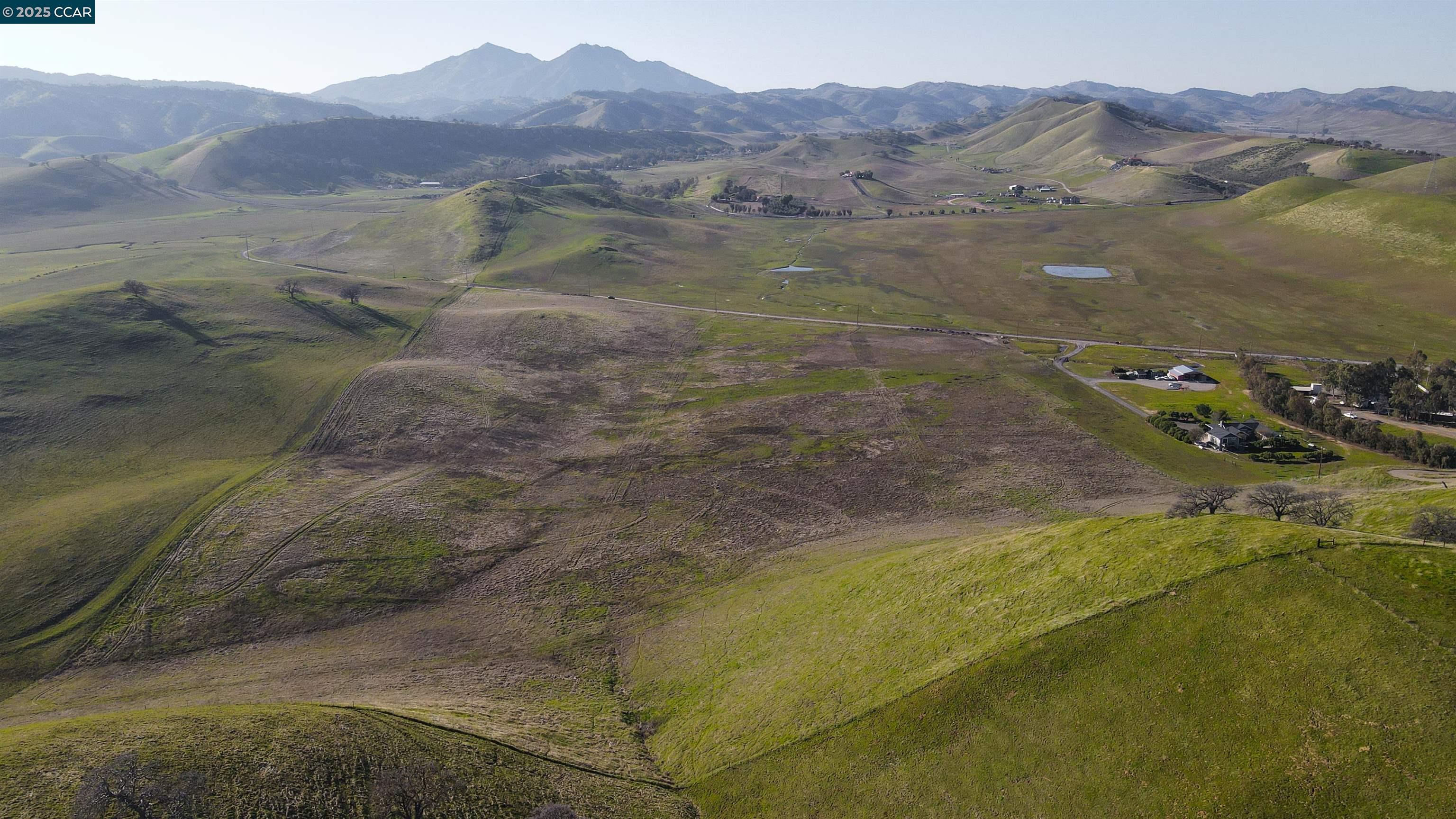Briones Valley Road Brentwood, CA 94513 - Photo 23 of 35 a view of a town with mountains in the background