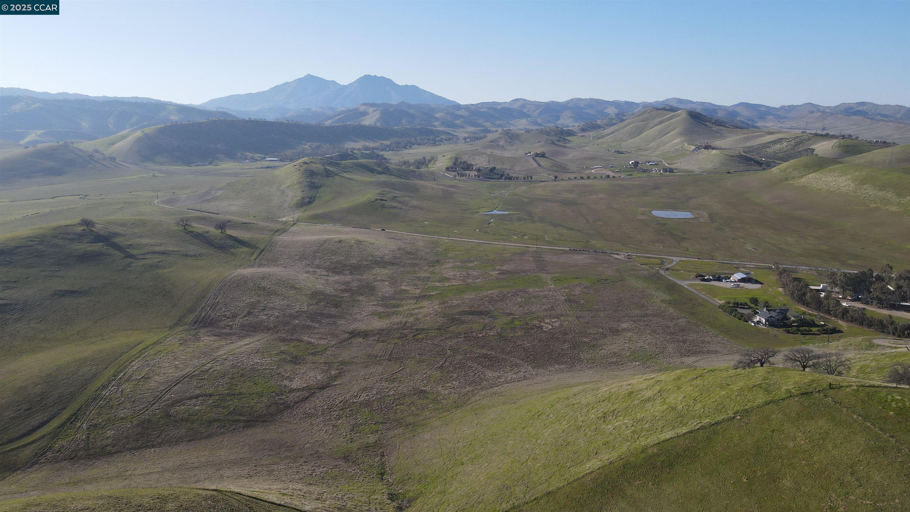 Briones Valley Road Brentwood, CA 94513 - Photo 24 of 35 a view of a forest with mountains in the background