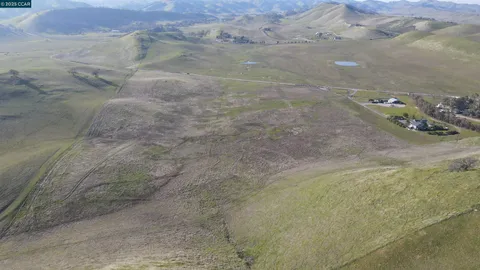 an aerial view of mountain with beach