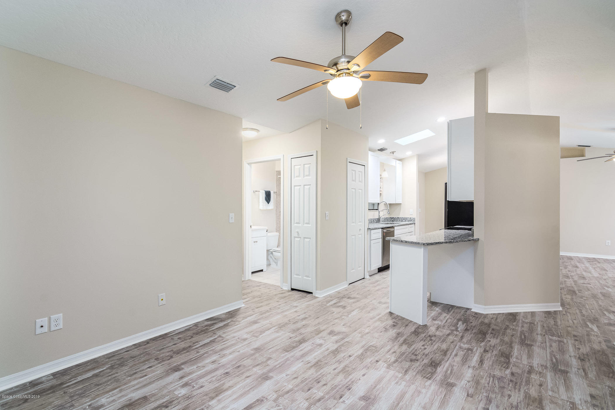 6965 Cairo Road Cocoa, FL 32927 - Photo 11 of 34 Family room overlooking kitchen